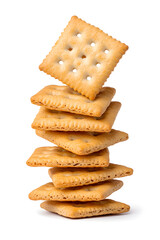 Stacked pile of crispy saltine crackers, isolated on white background
