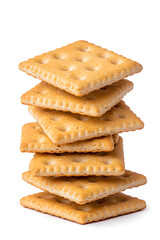 Stacked pile of crispy saltine crackers, isolated on white background