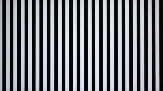 Abstract black and white stripes moving slowly across the screen from right to left, abstract psychedelic background or screensaver