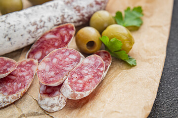 Fuet sausage Spanish meat delicacy fresh gourmet food background on the table rustic food top view...