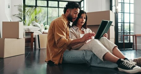 Boxes, tablet and couple on floor, conversation and relax in living room with new property. People, apartment and man with woman, tech and digital app for real estate, love and renovation in lounge