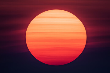 Glowing sun in twilight sky, celestial spectacle of warm colors
