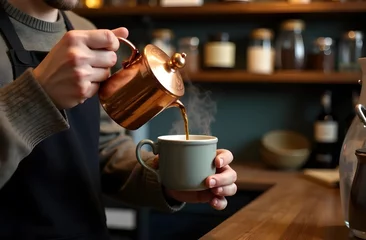 Fototapeten barista holding a cup of coffee © IULIIA
