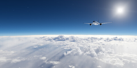 Airplane Flying Above the Clouds in a Clear Blue Sky