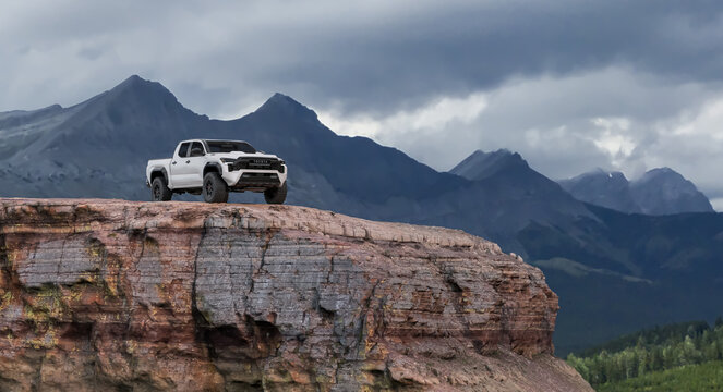 White Toyota Tacoma TRD Pro 2024 Truck Stands on Cliff Edge in Nature