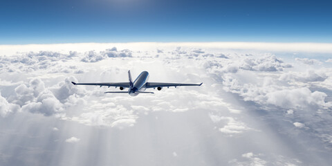 Airplane Flying Above the Clouds During a Clear Sunny Day