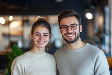 Fototapeta premium Happy Young Couple Smiling Together in Modern Cafe Environment with Natural Lighting