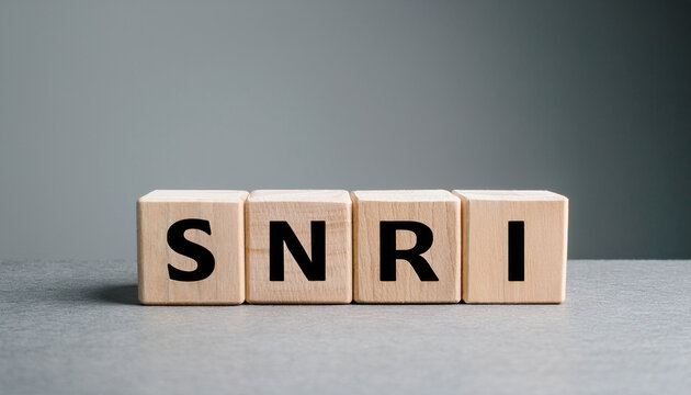 Wood cubes with abbreviation SNRI on table. Serotonin-Norepinephrine Reuptake Inhibitor.