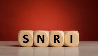 Wood cubes with abbreviation SNRI on table. Serotonin-Norepinephrine Reuptake Inhibitor.