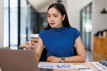 Financial Business man analyze the graph of the company's performance to create profits and growth, Market research reports and income statistics, Financial and Accounting concept.	

