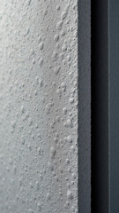 Close-up shot of textured grey acoustic panel.