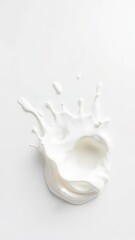 Creamy milk splashes on a snowy white background, droplets, fluid