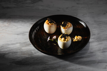 Spicy Deviled Eggs toppped With Caviar