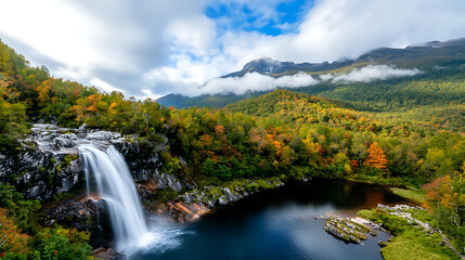 Aerial view of a majestic waterfall surrounded by vibrant forests nature photography scenic landscape tranquil environment