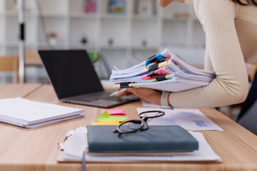 Business Business Documents, woman hands working in Stacks of paper files for searching and...