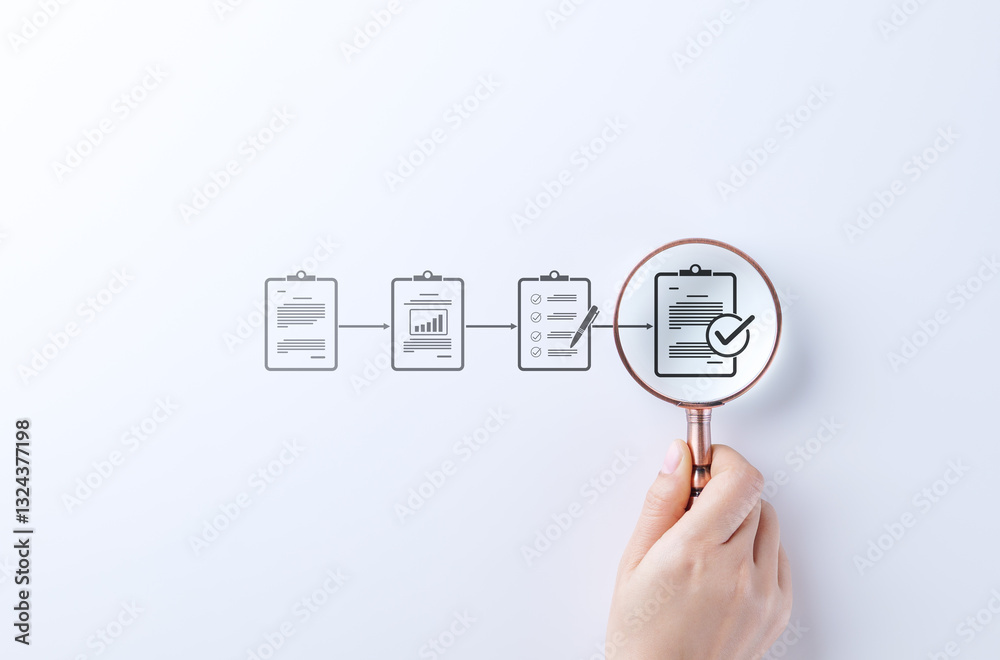 Aufkleber document review and quality control process. a hand holding magnifying glass focuses on completed ch
