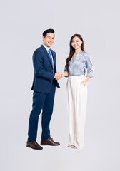 Full body image of young asian business couple posing on white background
