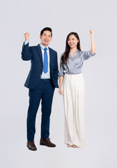 Full body image of young asian business couple posing on white background