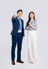 Full body image of young asian business couple posing on white background