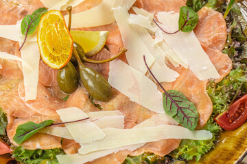 Salmon carpaccio, salad salmon appetizer served on a plate, copy space, top view