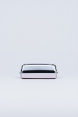 solitary stapler centered on unblemished white background showcasing its sleek metallic form with soft shadows ideal