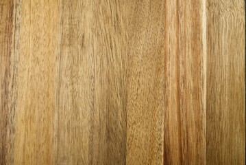 Obraz premium The image shows a close-up of a rich warm wood grain texture background in a light brown color. The wood grain is horizontal and has a beautiful natural pattern.