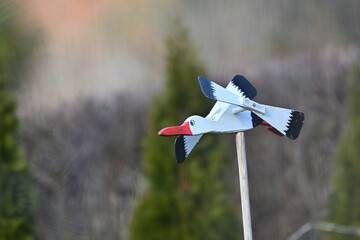 Wooden garden decoration in the form of a flying stork