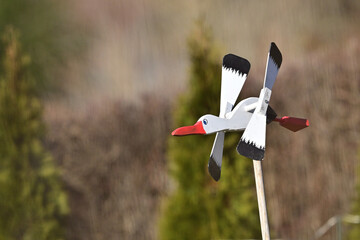 Wooden garden decoration in the form of a flying stork