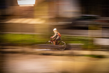 Fototapeta premium Biycle passing fast at night