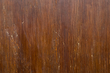 Obraz premium Aged wood grain wall with scratches and faded varnish. Worn texture. Vintage grunge surface. Retro style. Abstract brown background