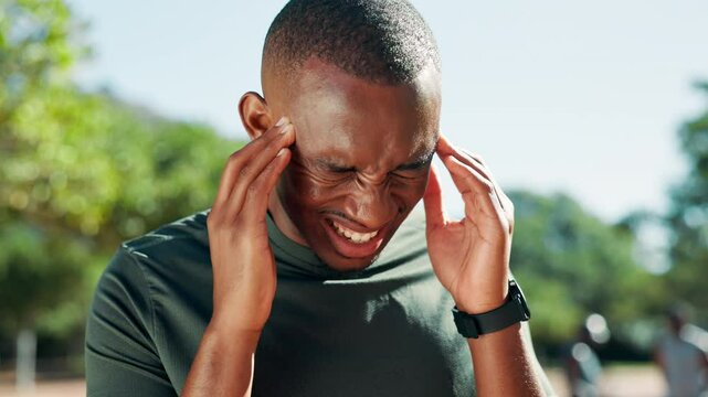 Man, headache or fitness with pain for stress, strain or intense ache at outdoor park. Male person, migraine or accident with vertigo or dizziness from overworked workout, heat or exercise in nature