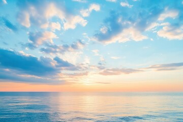 Obraz premium Tranquil Sunrise Over Calm Ocean Waters with Soft Clouds and Gentle Waves at Dusk