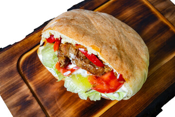 Delicious pita sandwich filled with fresh ingredients and grilled meat