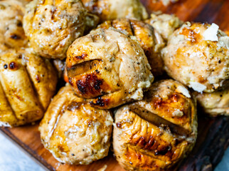 Grilled meatballs with spices served on wooden board
