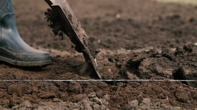 agriculture, farmer dripping soil foot rubber boots, ground, earth business, plowing agricultural land, farmer rubber boots dripping soil field, digging field close-up, farmer digging soil garden bed