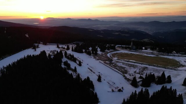 Aerial drone morning view of ski resort Rogla at sunrise dawn. Panoramic winter shot of Ski center Rogla, Slovenia