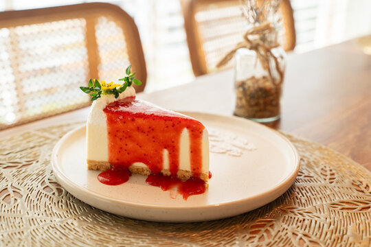 A delicious slice of chocolate cake with fresh strawberries and cream.Strawberry cheese cake on white plate.Morning cafe with your favorite bakery.Selective focus point