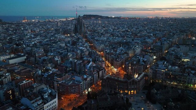 Night drone shot of Barcelona city in Spain, Barcelona is capital of Catalonia, aerial view of downtown Barcelona with night lights