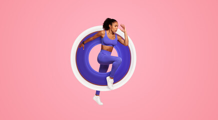 Athletic African American Lady In Fitwear Jumping Exercising During Training Over Pink Studio Background, Full Length, Side View Shot. Sport Motivation And Fitness Workout Concept