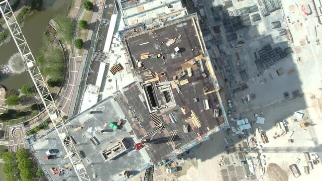 Cinematic aerial views of active construction sites in Atlanta, GA, featuring machinery, workers, and evolving structures under clear skies&mdash;ideal for commercial, real estate, or industrial use.