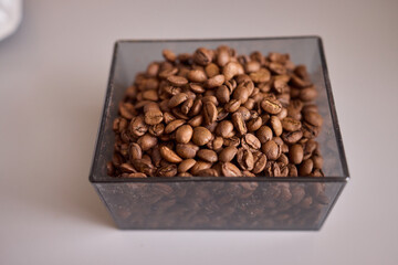 Delicious Fresh Coffee Beans Stored in a Beautiful Glass Container for Your Enjoyment