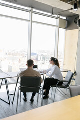 Two business office workers in office building