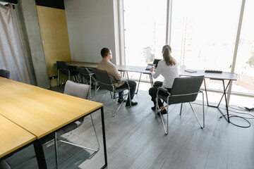 Two business office workers in office building