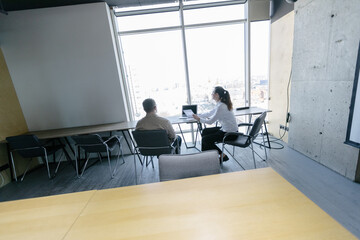 Two business office workers in office building