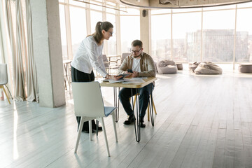 Brainstorming by two people in office