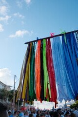 Colorful fitinhas do Bonfim hang from a totem at a street vendor’s stand in Salvador, Bahia,...