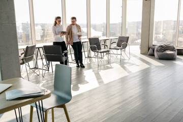 Office workers discussing indoors the job