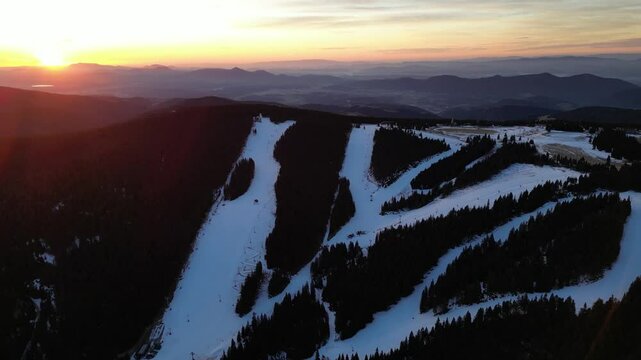 Aerial drone morning view of ski resort Rogla at sunrise dawn. Panoramic winter shot of Ski center Rogla, Slovenia