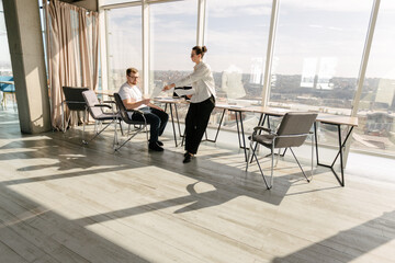 Two office workers working together 
