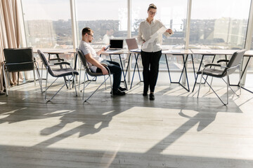 Two office workers working together 